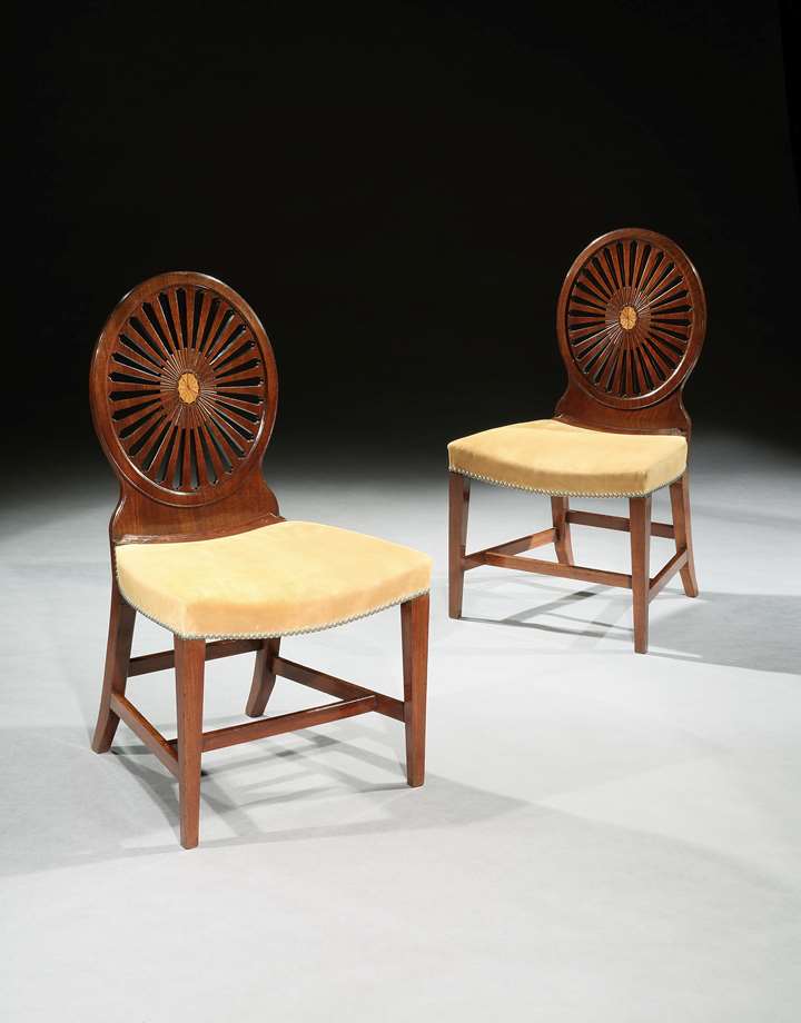 A PAIR OF GEORGE III MAHOGANY WHEEL BACK SIDE CHAIRS
